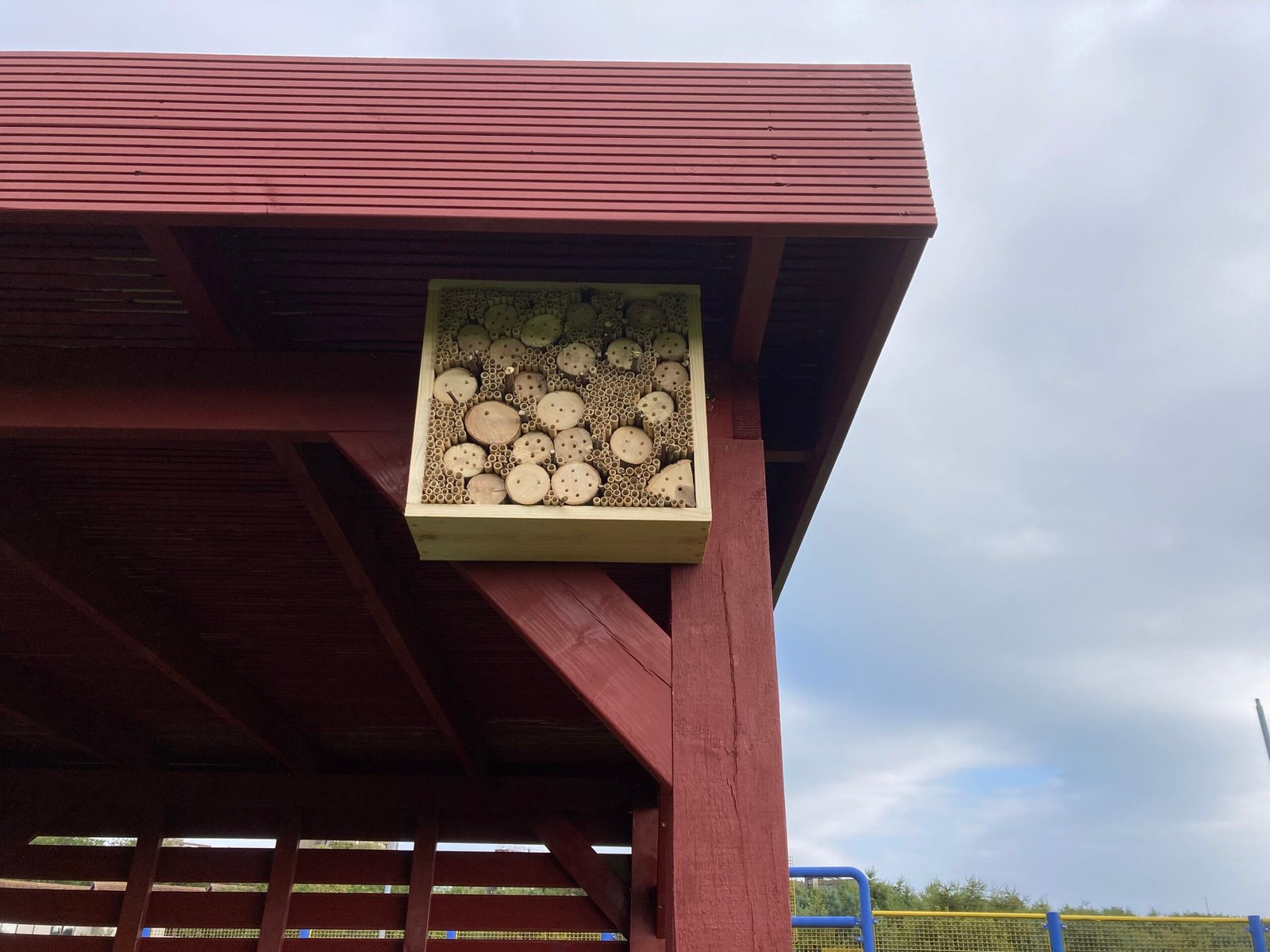 The finished Bee Hotel mounted to the top of the outdoor classroom